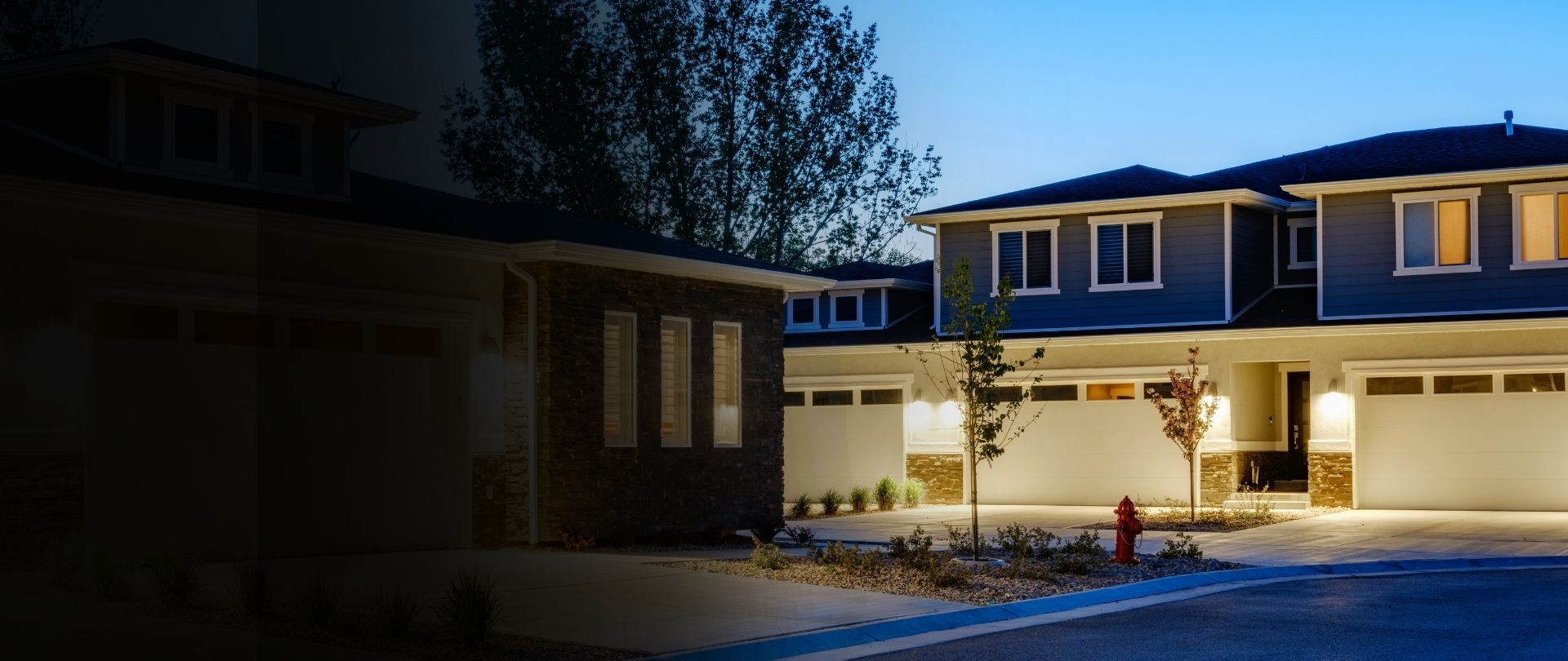 Mid century modern homes in a neighborhood at dusk.