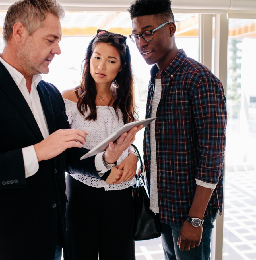 Realtor and couple getting cash approved with a cash offer loan.
